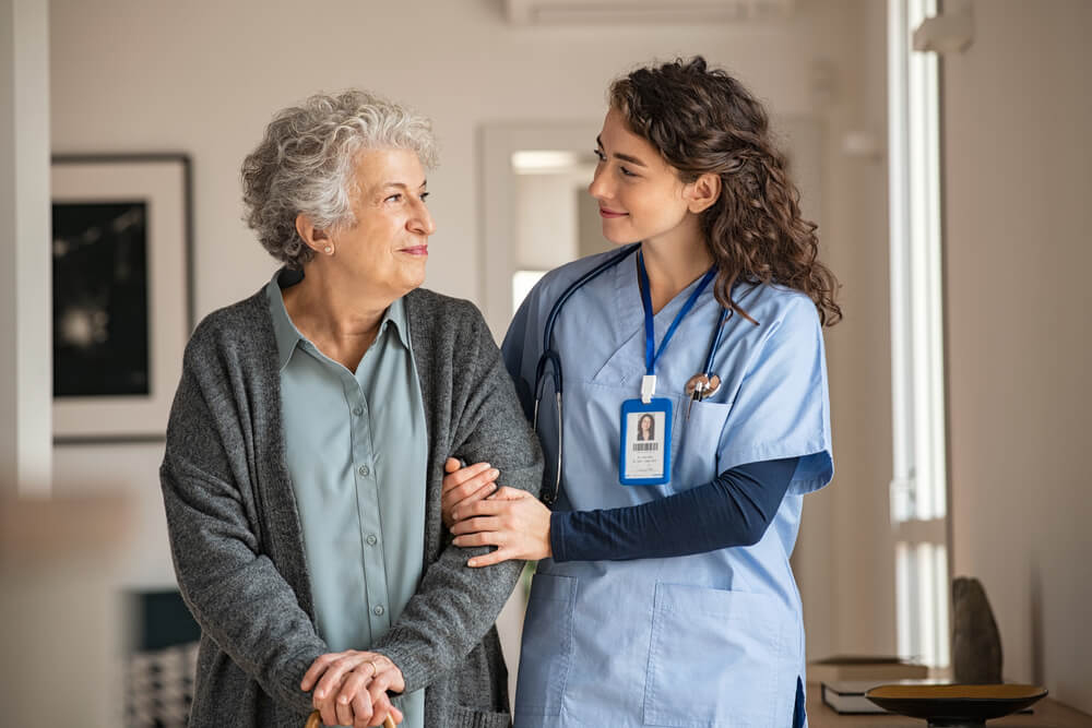 A medical professional with an old patient at a clinic in Jumeirah