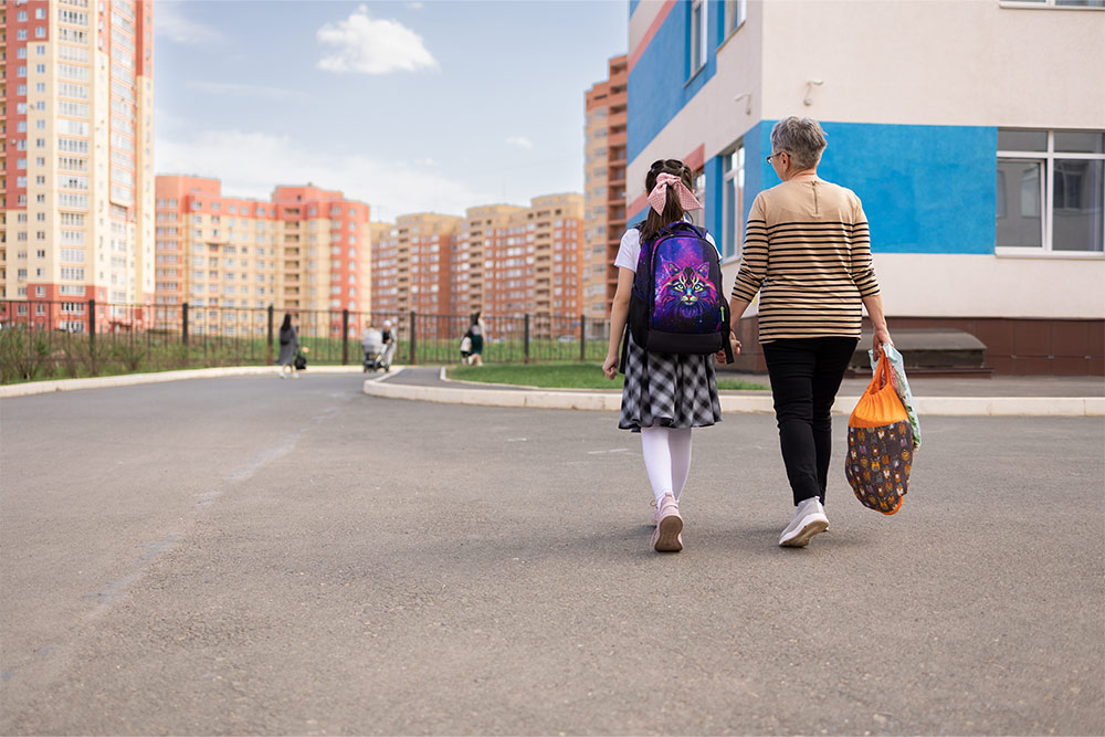 A mother dropping her kid off at school in Mirdif