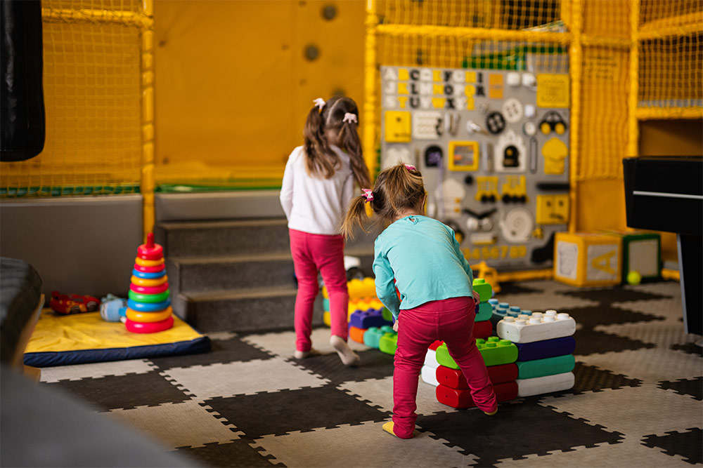 Siblings playing with LEGOs