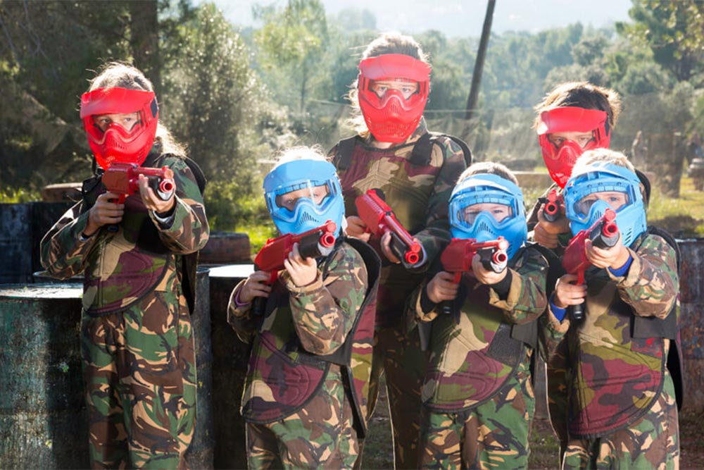 Kids playing paintball