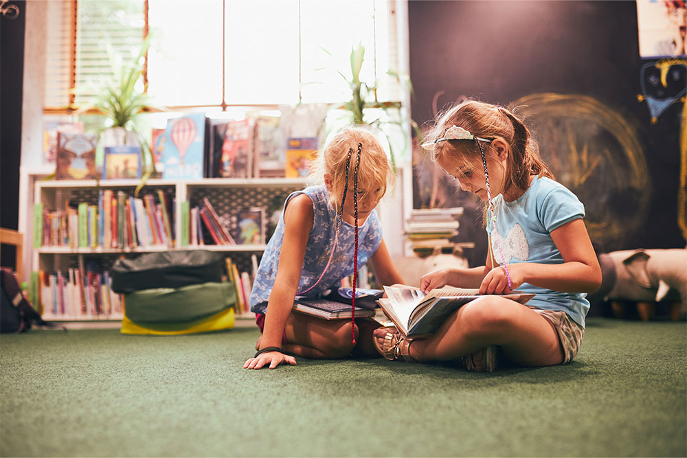 Kids reading books in the Garden library