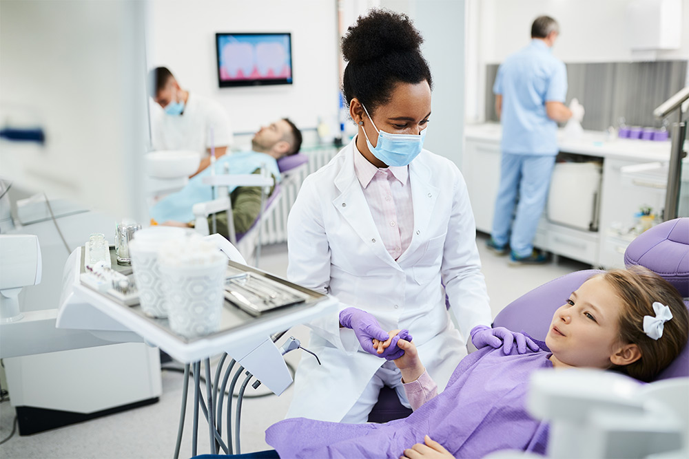Dentist with a kid in a dental clinic