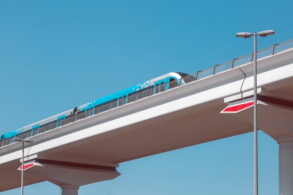 metro passing through the bridge near dubai silicon oasis