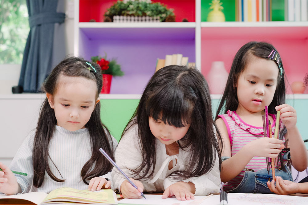 Multicultural children studying together 
