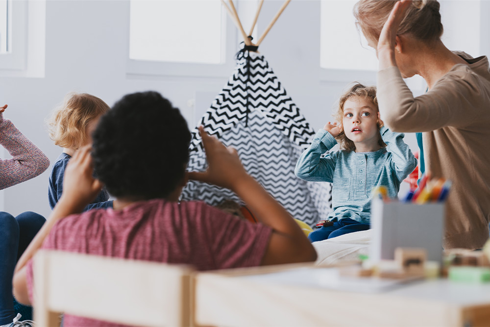 An instructor guiding young learners in an affordable nursery in Dubai