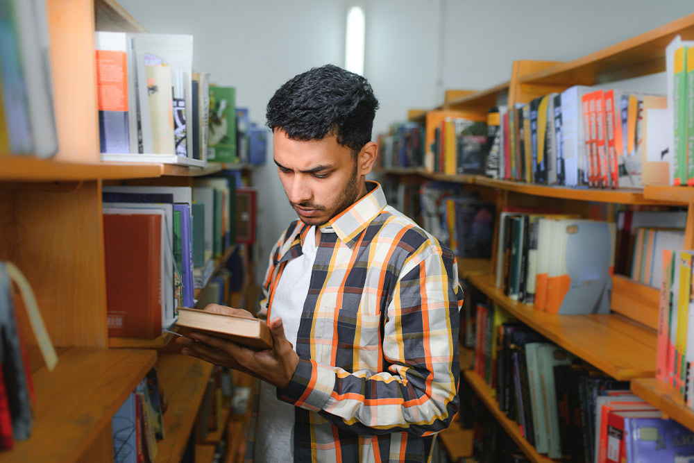 Man Reading a Synopsis of a Book
