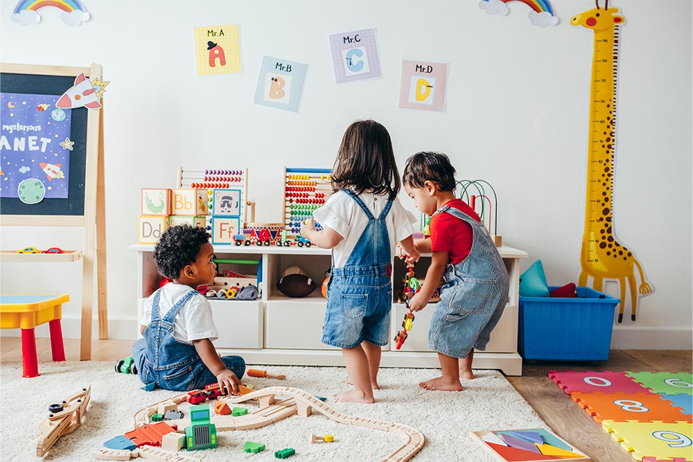 Kids playing with each other in a playroom 
