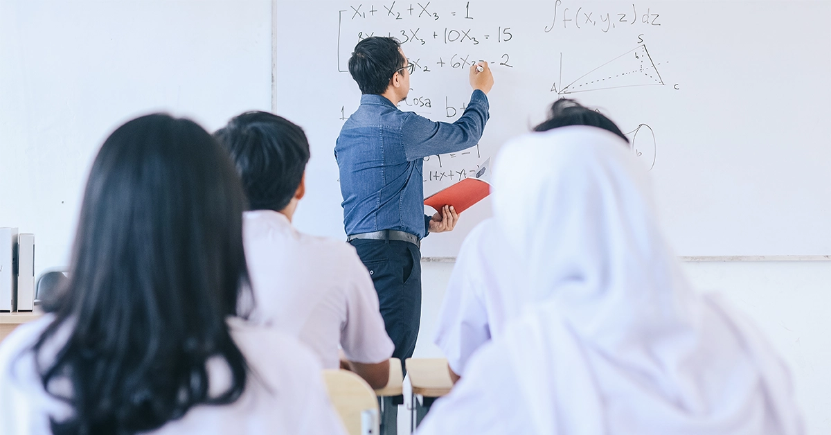 Maths Teacher Writing on the Board