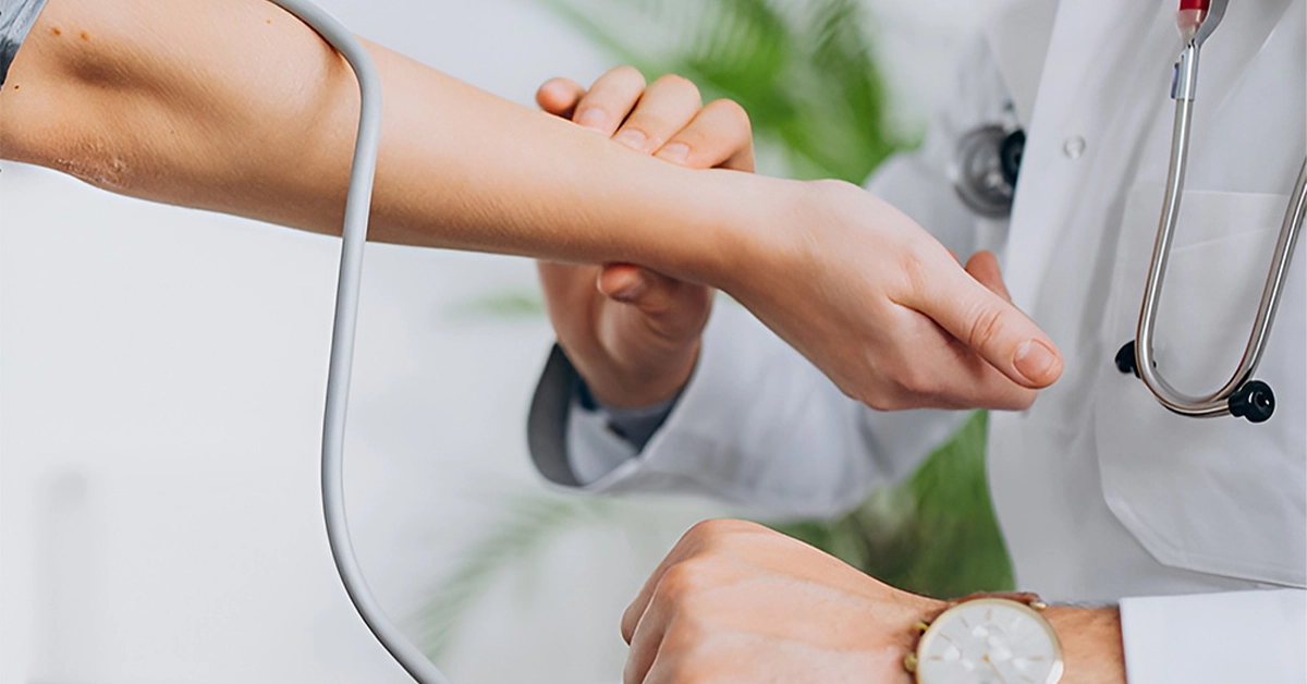 Doctor checking blood pressure