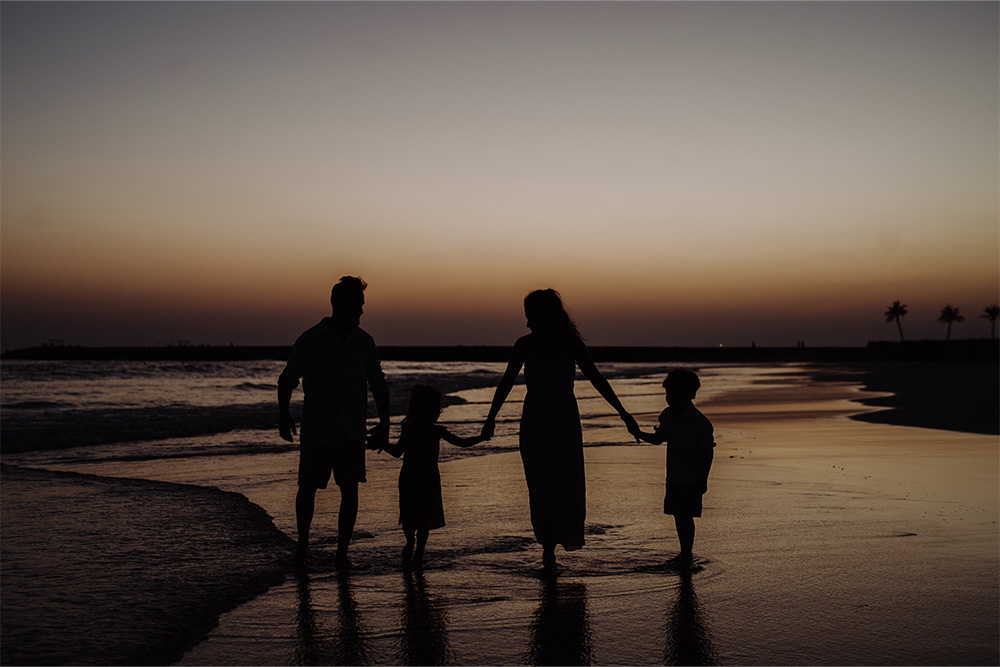 A family at a Dubai night beach