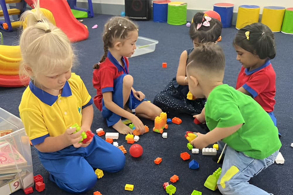 Young children enjoying an activity at Circle Time in Karama Dubai