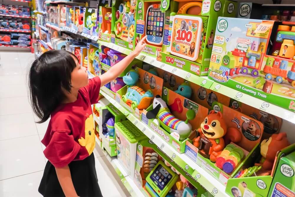 A girl looking at educational toys