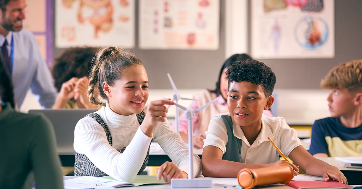 School students studying wind turbines
