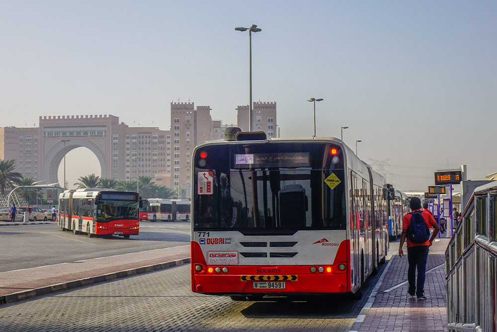Using a public bus to travel to the Palm Jumeirah Monorail station 