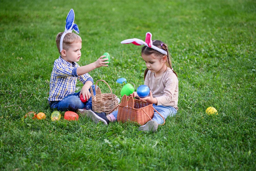 Children collecting Easter eggs at the best Easter egg hunt in Dubai 