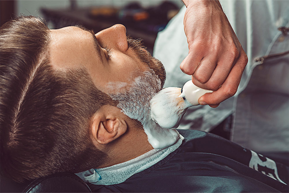Man Getting His Beard Shaved
