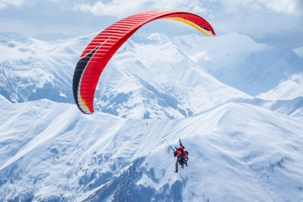 People paragliding at one of the top holiday destinations from Dubai 