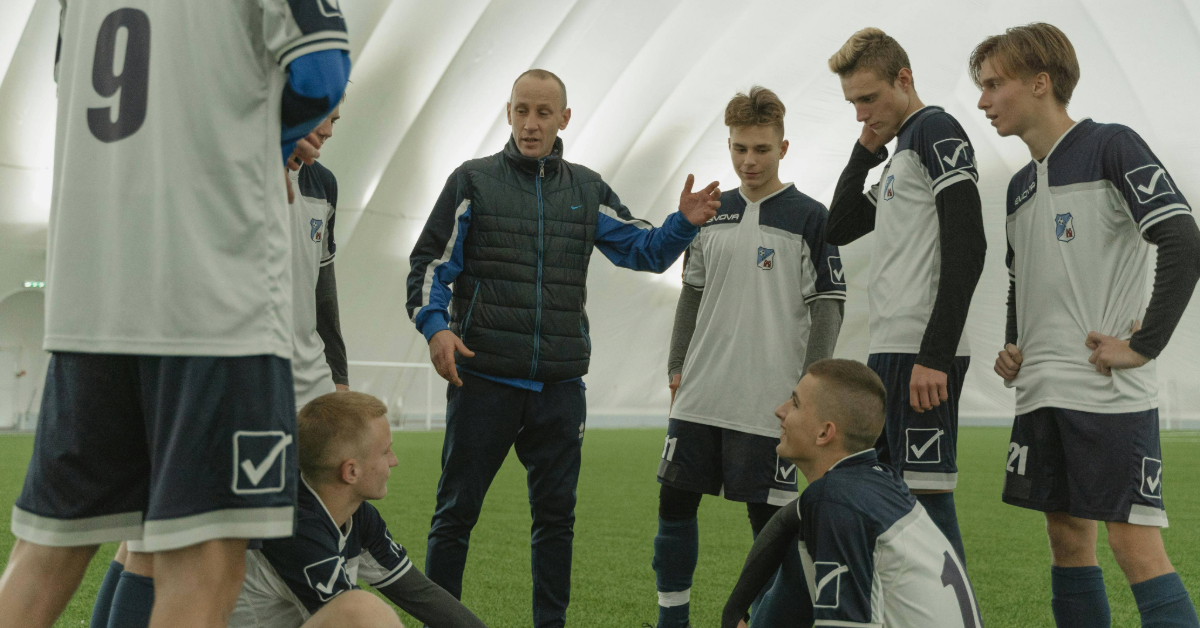 Football coach talking to his team