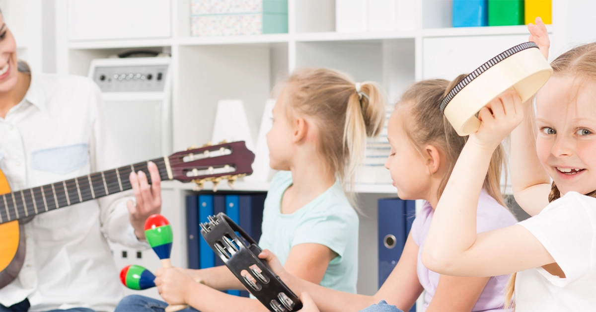 Teacher and students playing musical instruments
