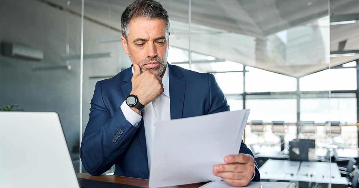 A business owner reviewing a Memorandum of Association in the UAE 