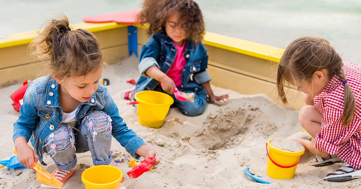 Multiethnic children in a sand play area 