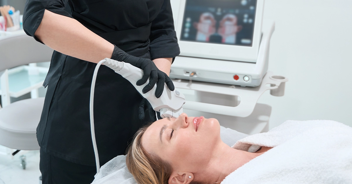 A woman getting a skincare treatment at an aesthetic clinic in Abu Dhabi