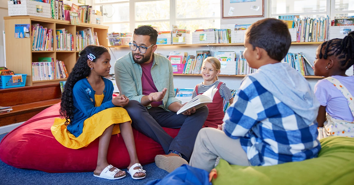 A teacher telling stories to kids in school