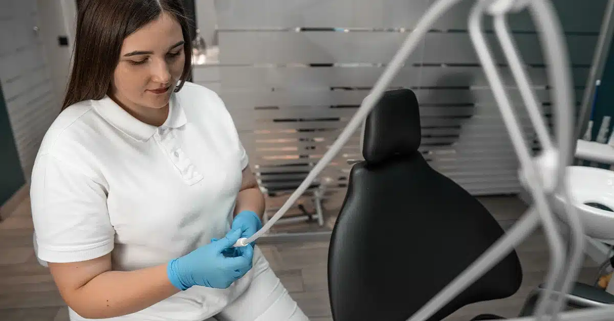Professional Dentist Preparing Her Equipment