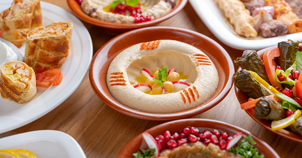 Arabic food servings, including hummus