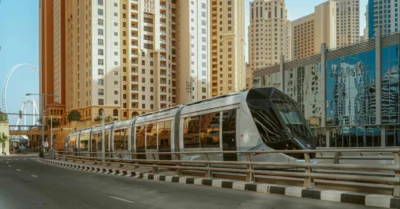 A tram near high-rise buildings