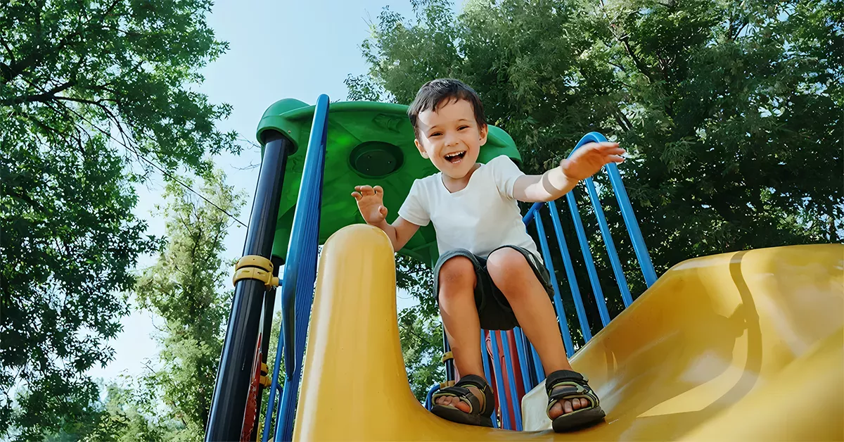 A kid playing in a park’s playground 