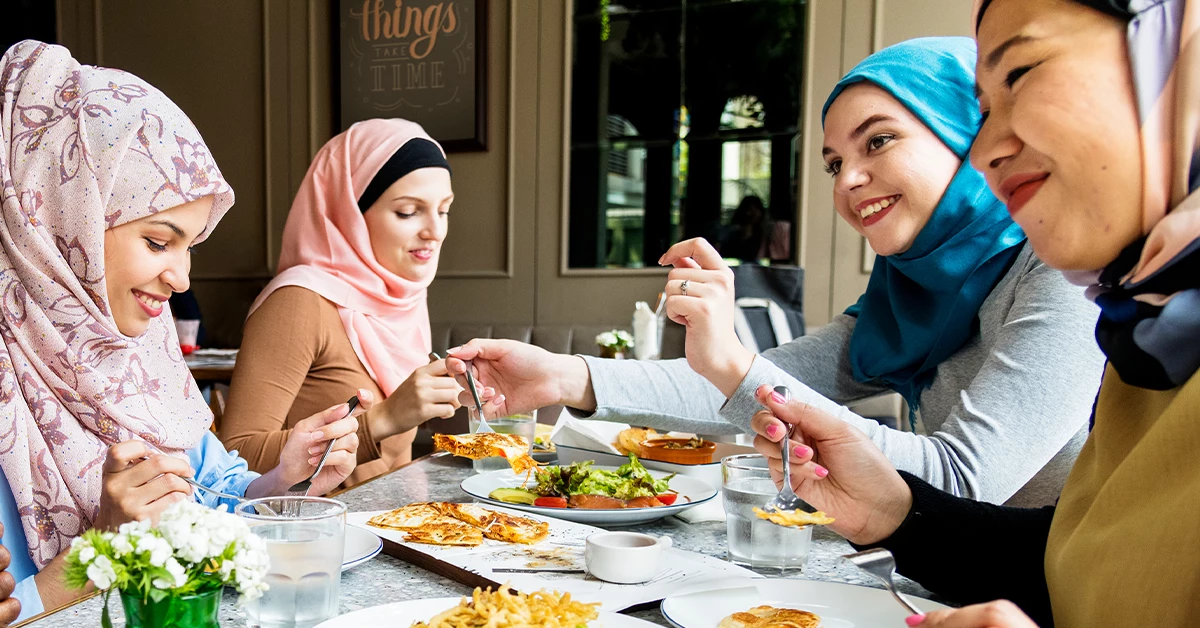 A group of friends enjoying lunch at a restaurant in Rashidiya, Dubai