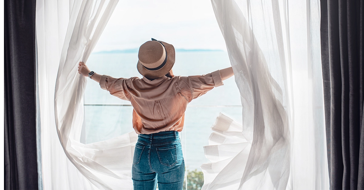 A solo traveller in a Jumeirah Village Triangle hotel room