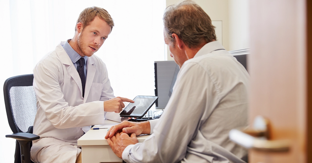 A patient having a consultation with a General Practitioner
