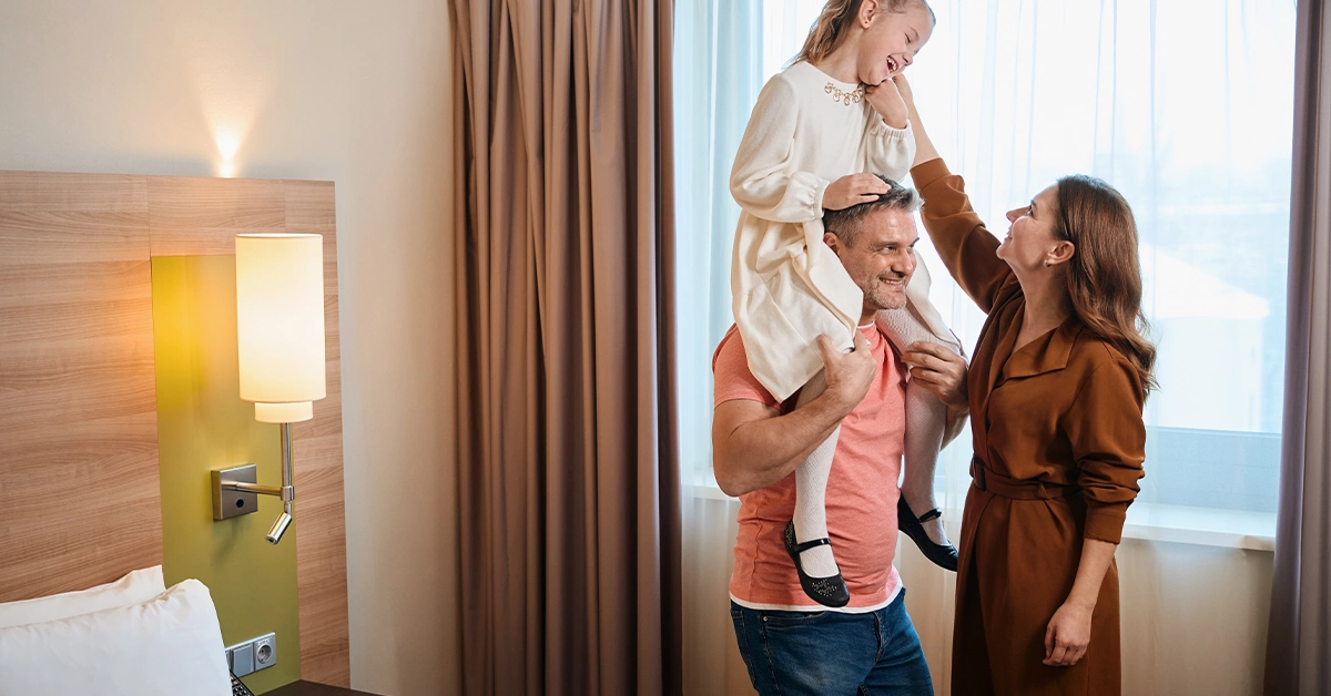 A family enjoying in a hotel room near the Corniche Abu Dhabi