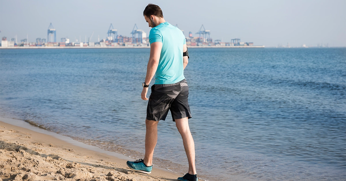 A man walking on a beach