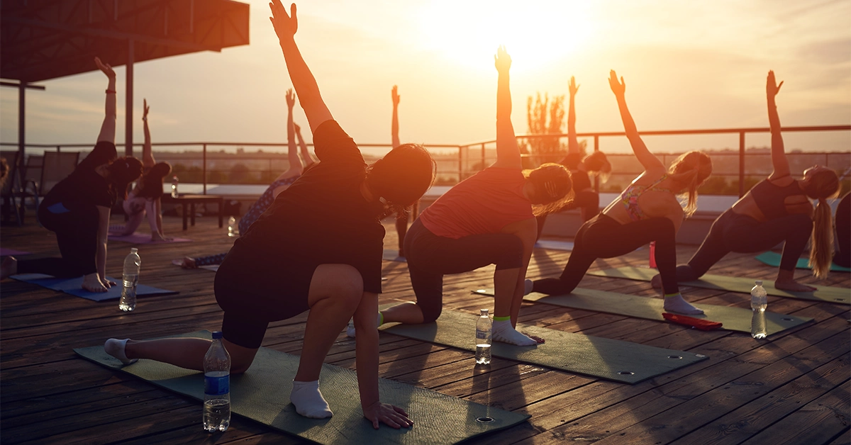 Men and women doing Pilates exercise in Dubai