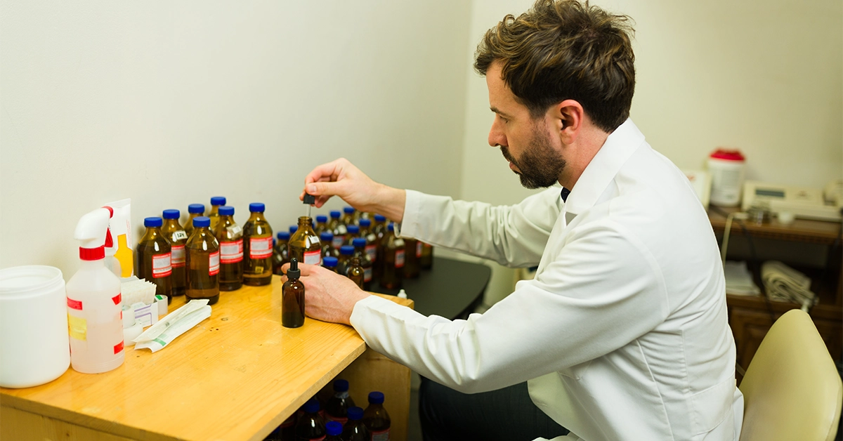 A homoeopathic doctor preparing medicines 