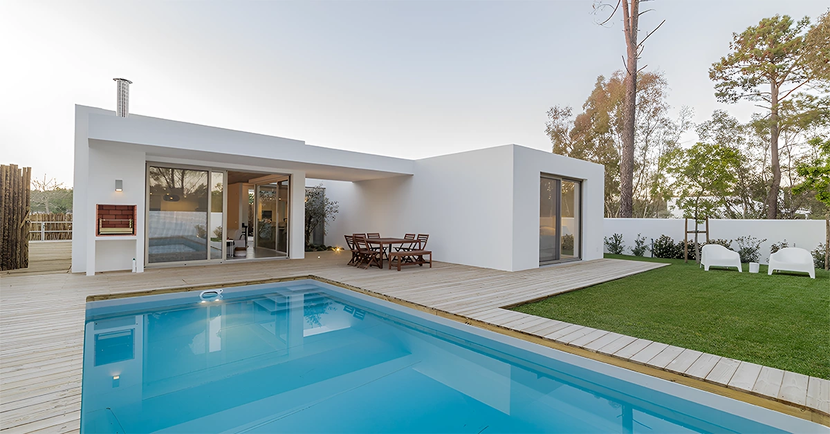 A modern villa with a garden and swimming pool
