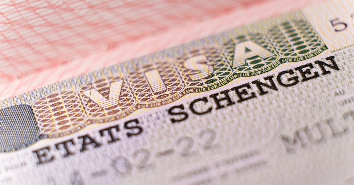 A passport stamped with a Schengen visa