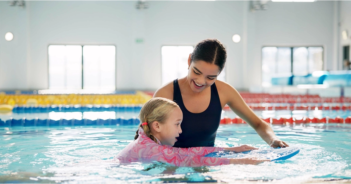 Swimming lesson with coach at summer camp in Ajman