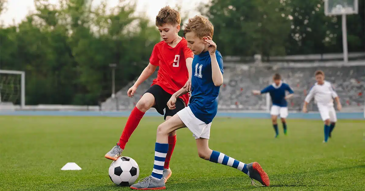 Boys playing football in a club