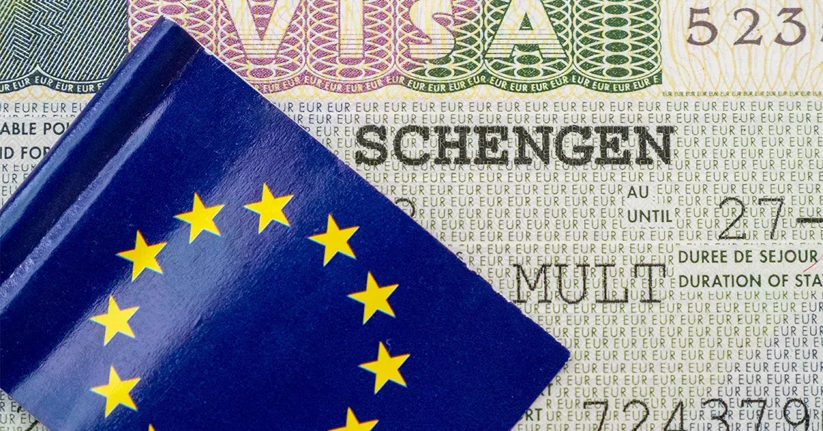 A Portugal visit visa from Dubai stamped on a passport
