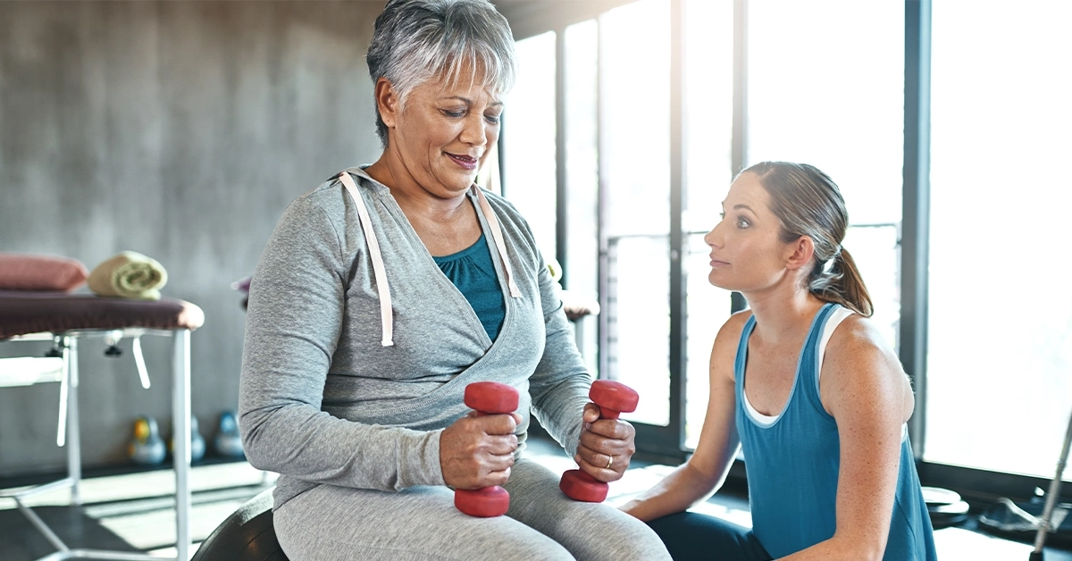  woman working out with dumbbells at DCore Gym in International City
