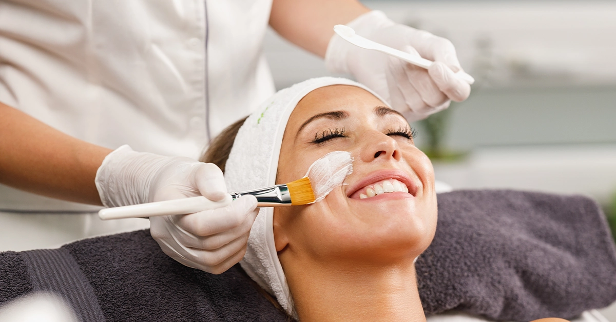 A lady getting facial services in a salon