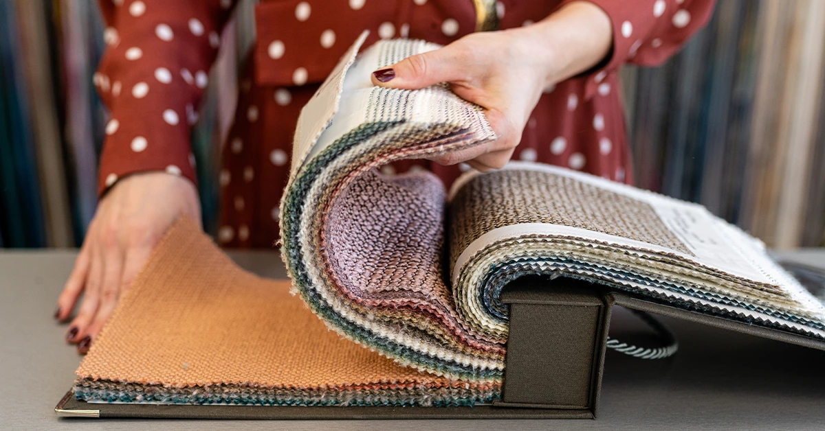 Woman Choosing Sofa Fabric