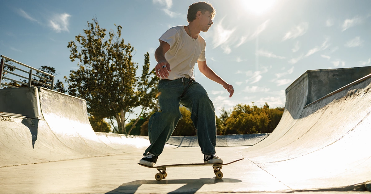 A young male skater performing skateboarding in Dubai Hills Skatepark