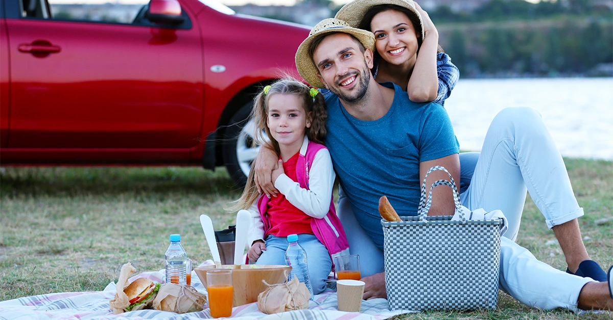 A happy family picnicking outdoors