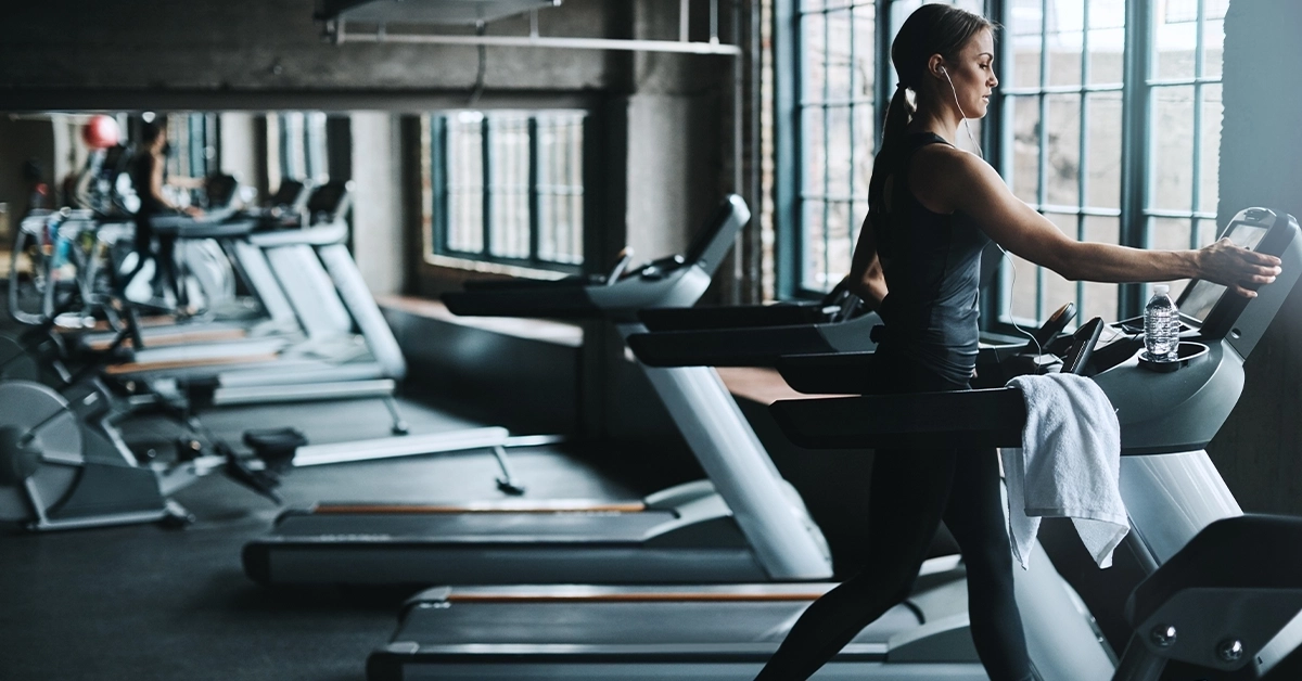 A woman running on a treadmill