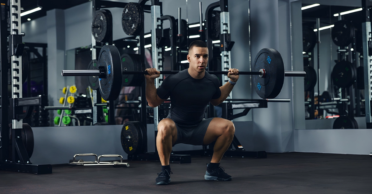 A man weight lifting at Power Gym in Karama